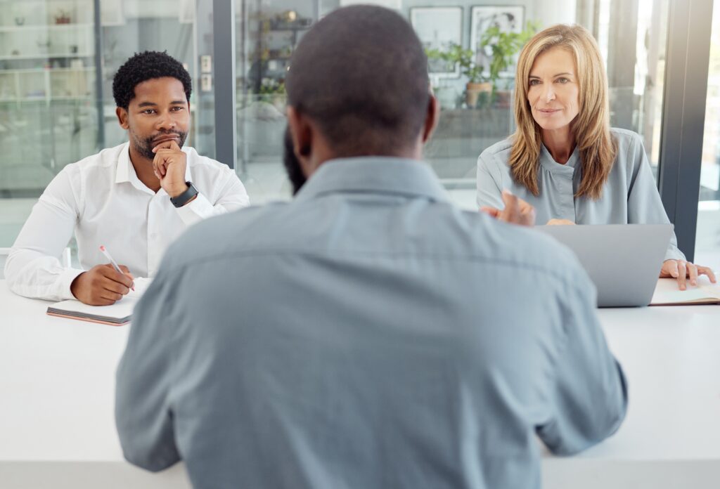 A sales rep applicant interviewing with recruiters